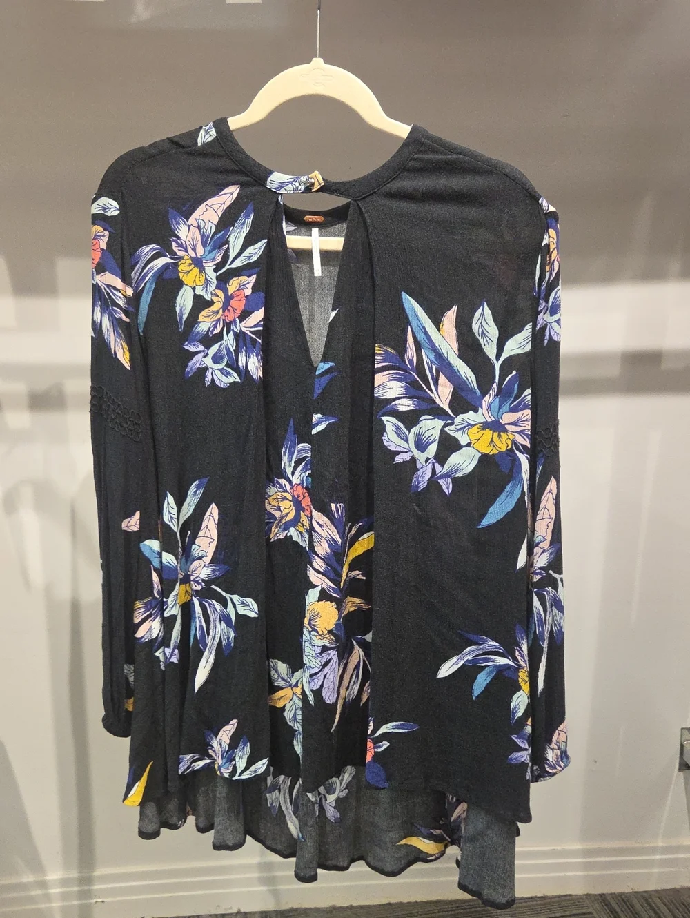 Free People black floral V-neck Top Blouse with blue and yellow Floral accents